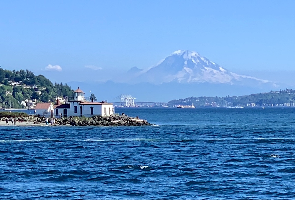 West Point Lighthouse and Mount Rainier as seen while touring the waterways around Seattle with Argosy Cruises