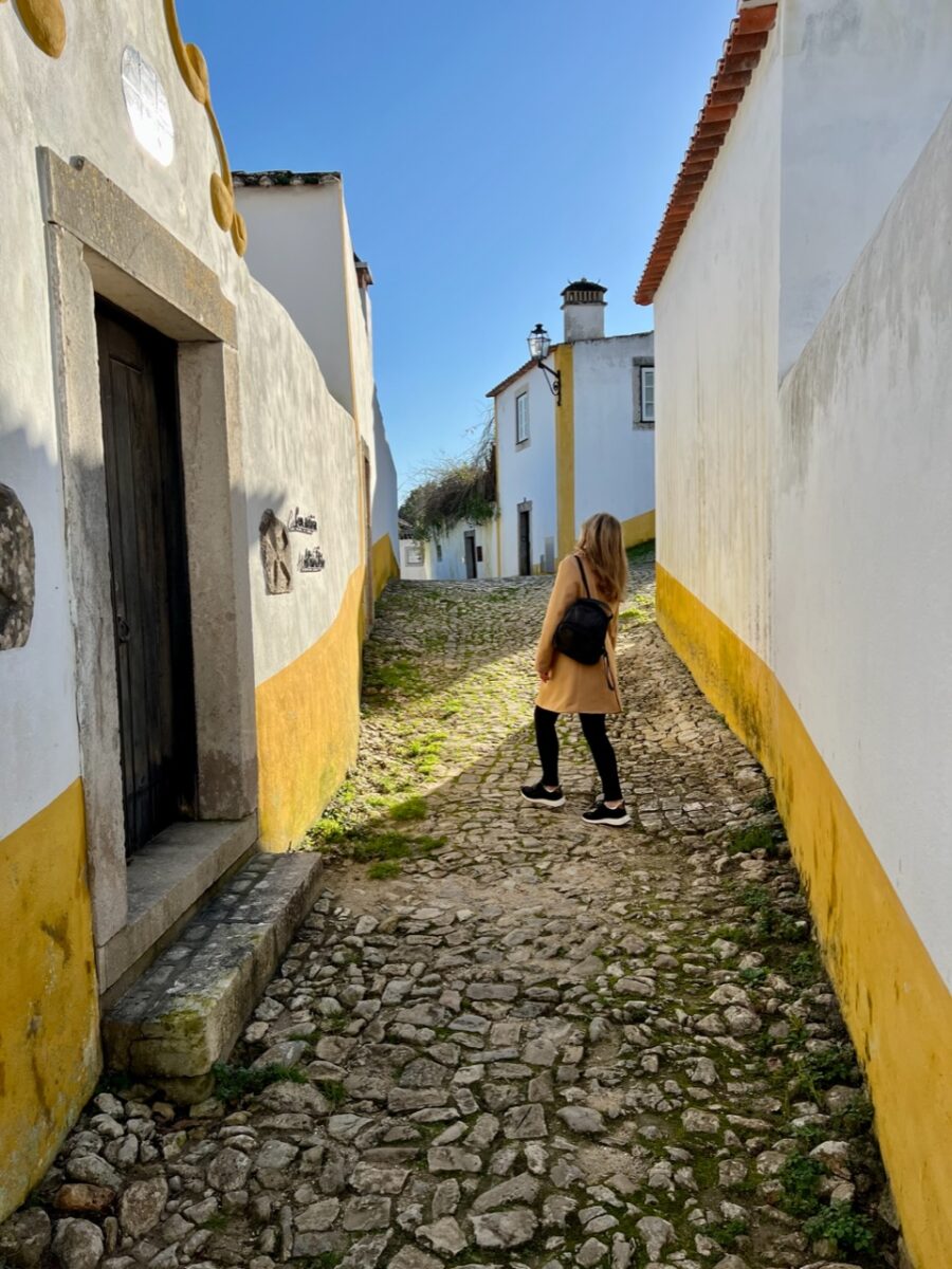 A woman admiring the architecture in Óbidos