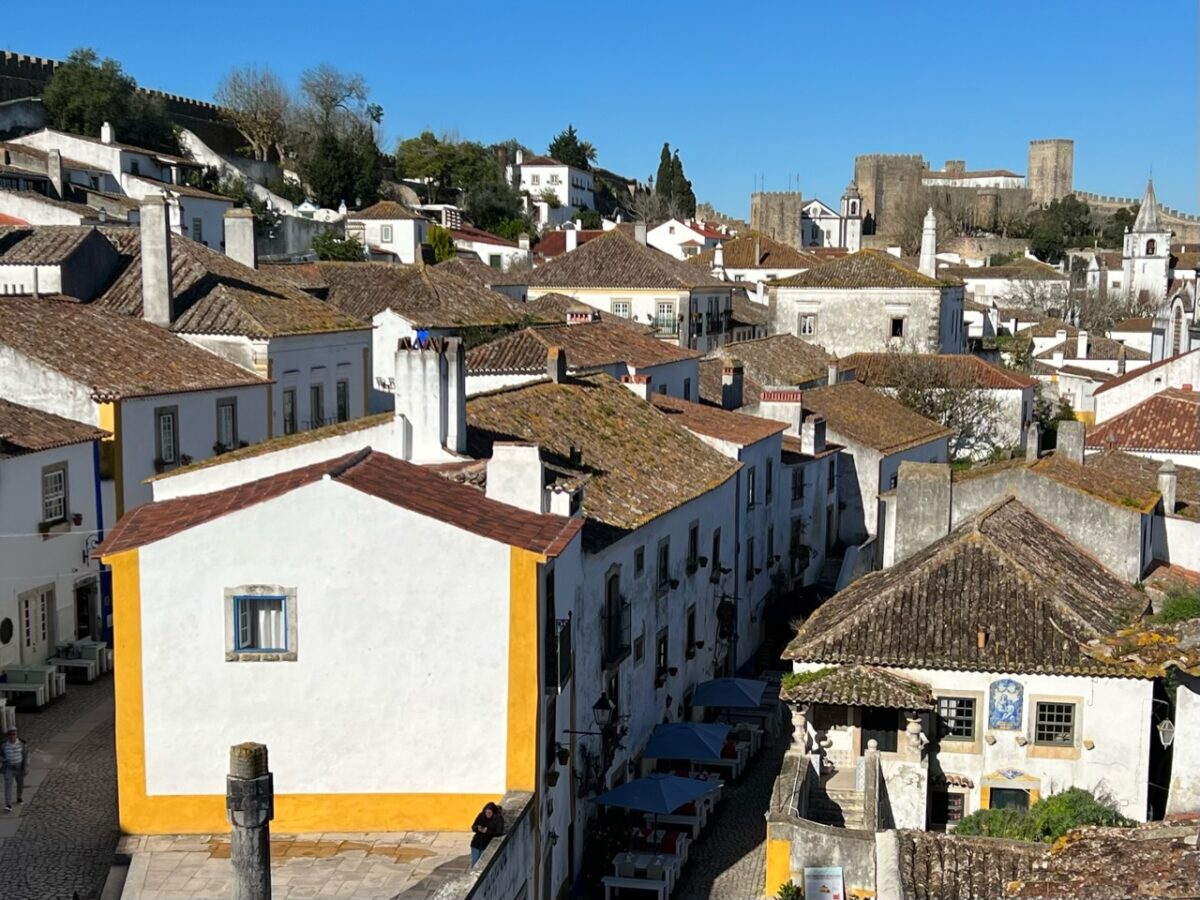 Looking out across the town of Óbidos Portugal towards the Óbidos Castle