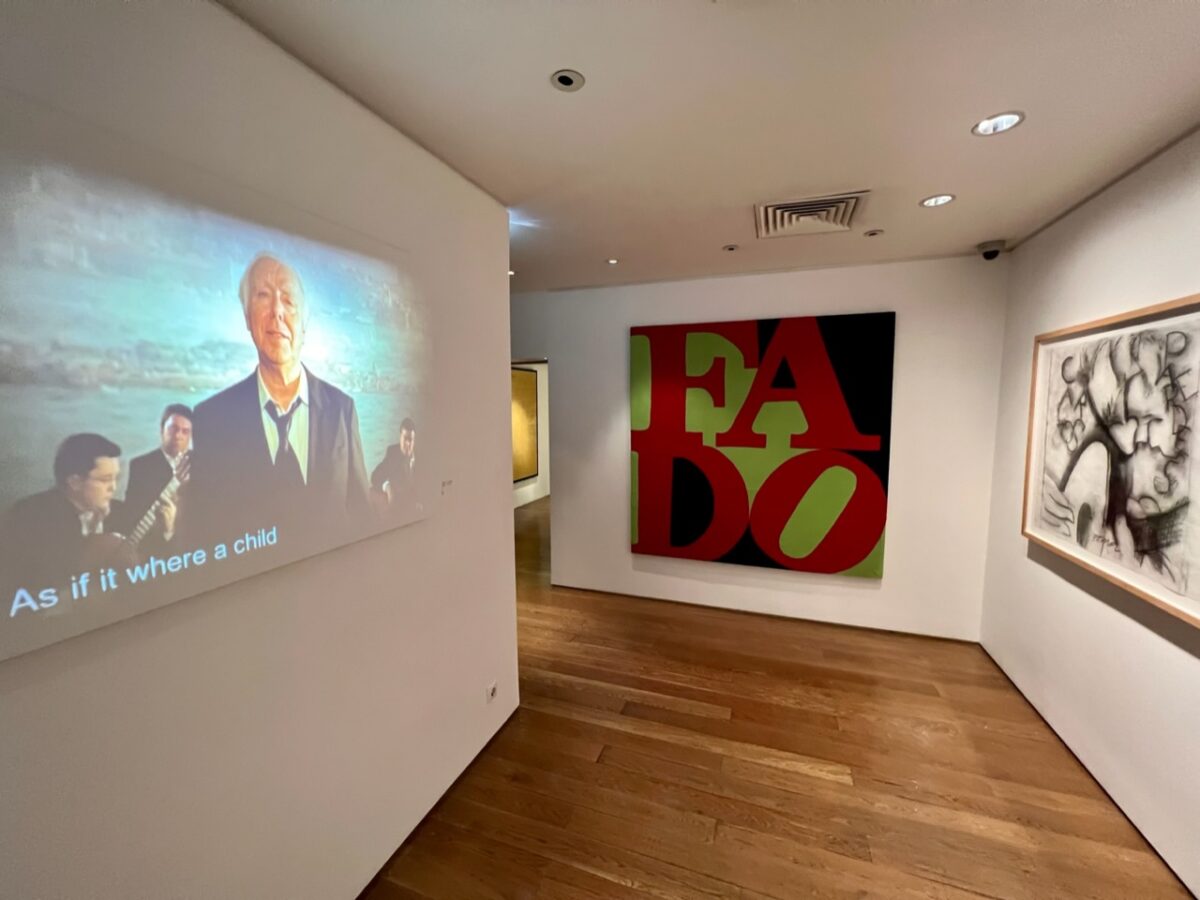 A hallway with various displays at the Fado Museum 