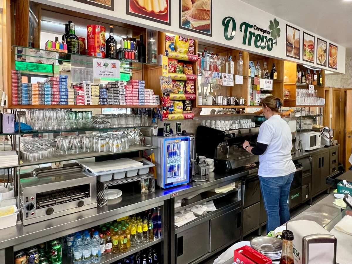 Behind the counter at O Trevo in Lisbon