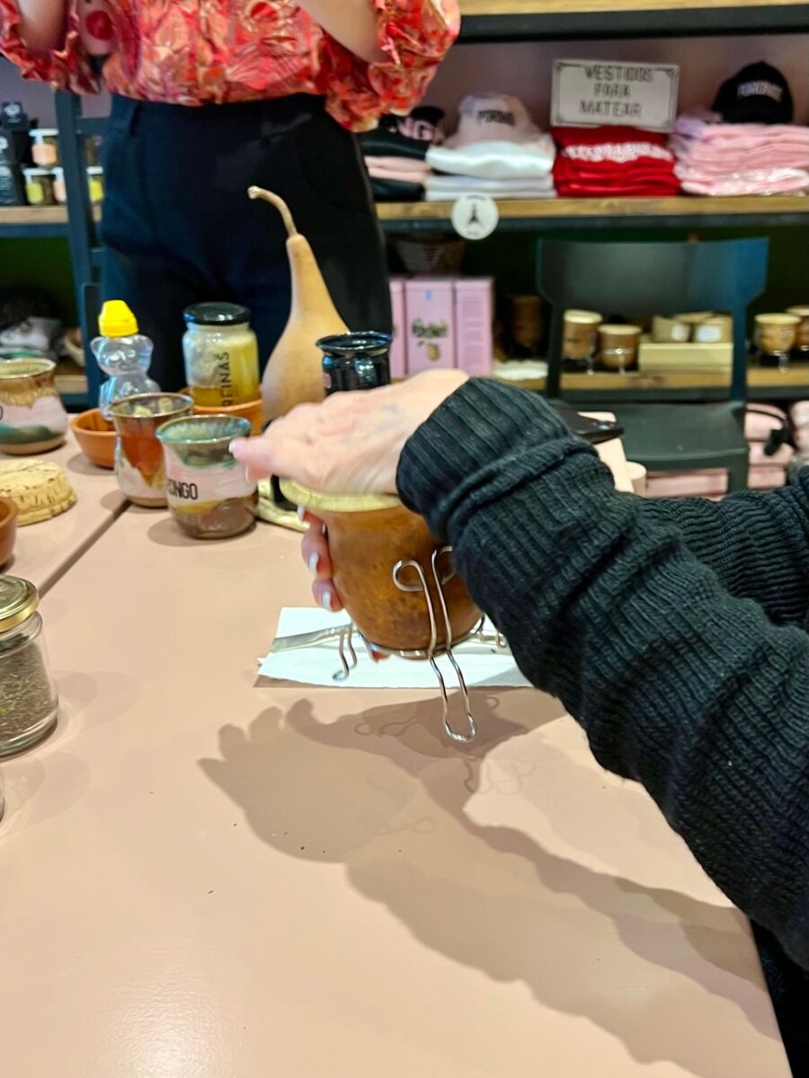 Shaking a Mate to help separate out the powder from the leaves