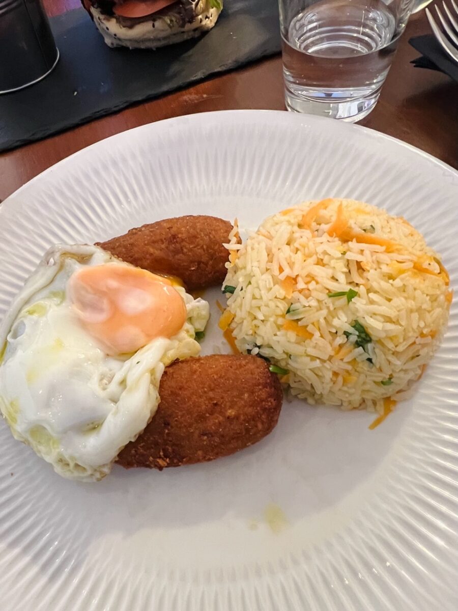 Alheira de Mirandela with egg and rice at El-Rei Dom Frango in Lisbon