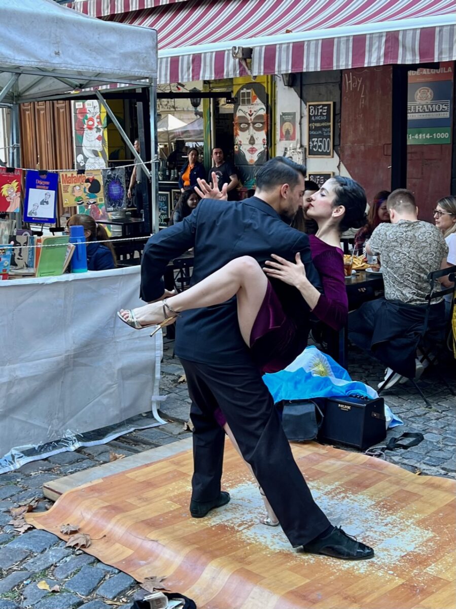Tango Dancers in between market stalls at the San Telmo Sunday Street Fair in Buenos Aires