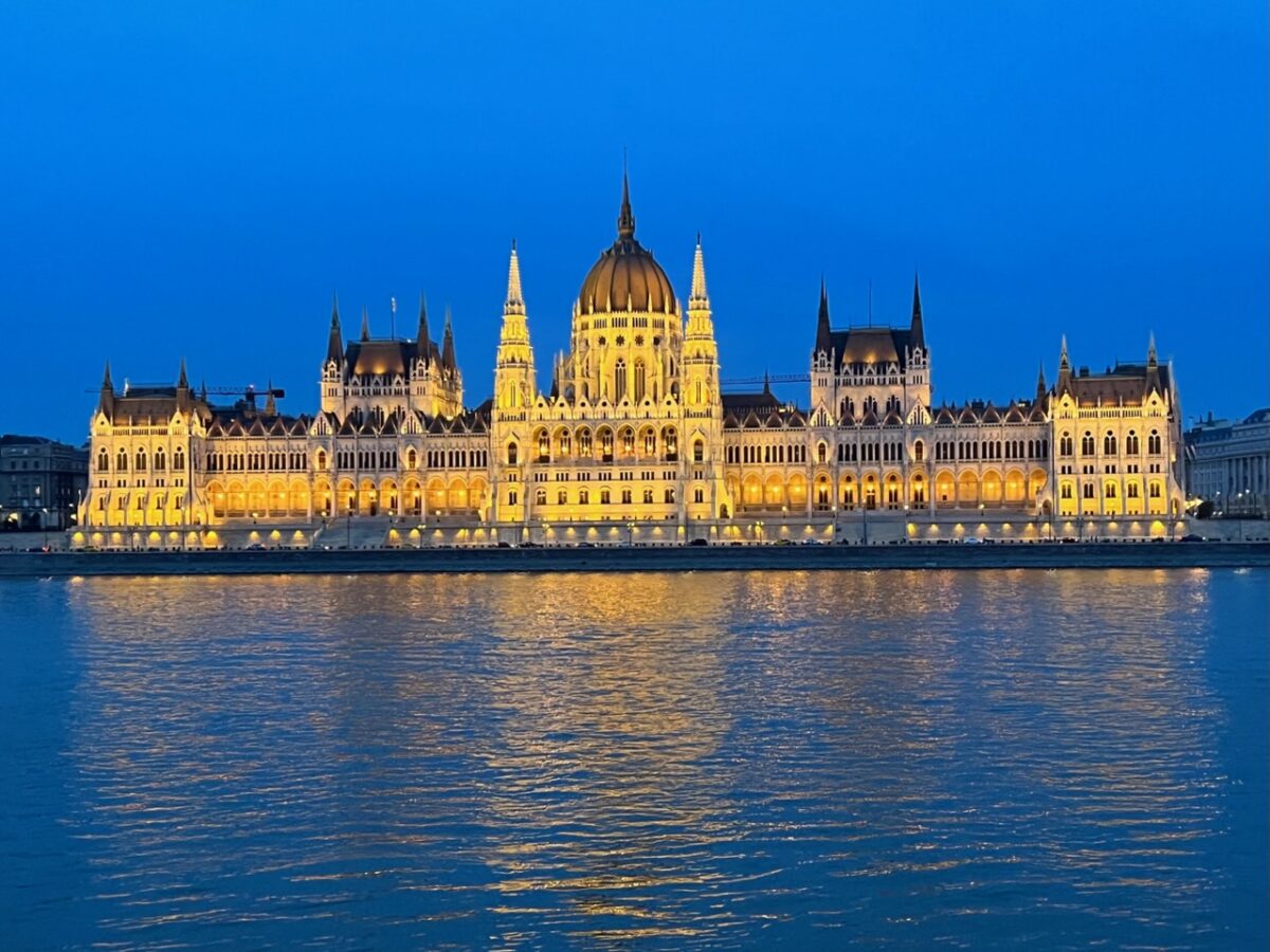 Hungarian Parliament in Budapest at night as seen from across the Danube River