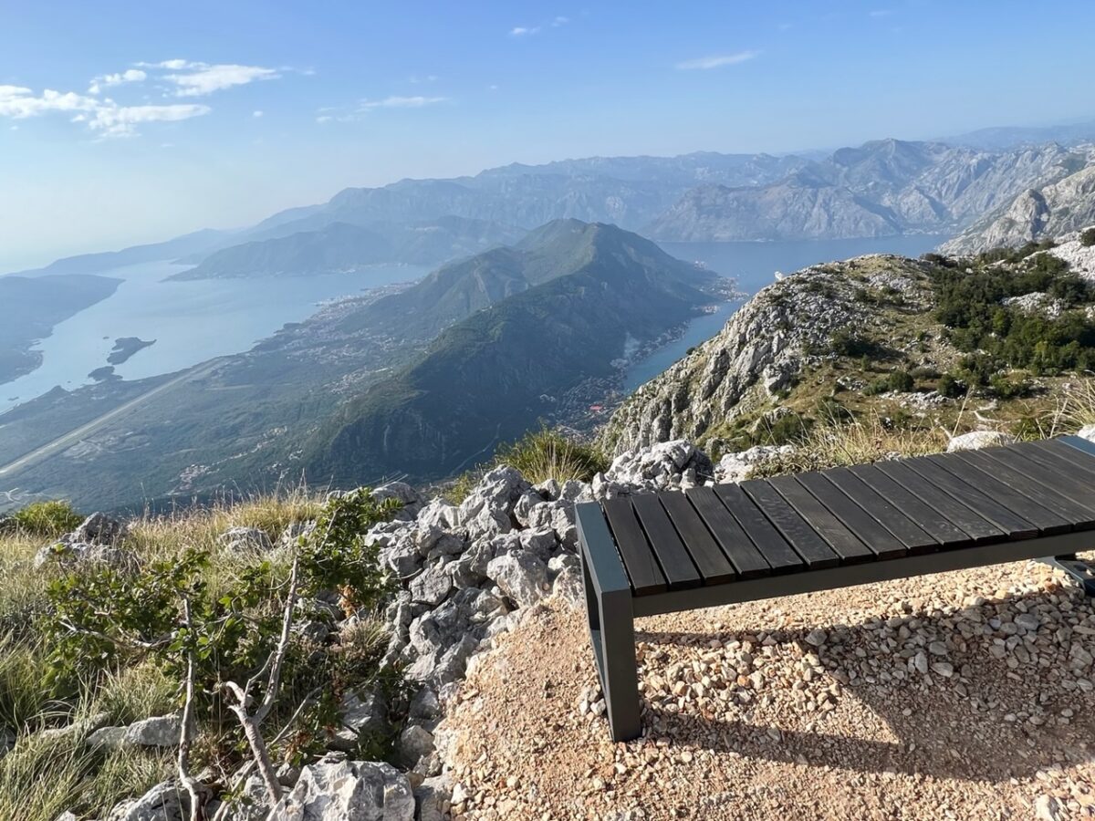 A bench along one of the trails on Mount Lovćen with a view down to the Bay of Kotor