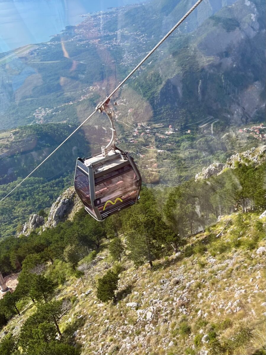 The Kotor Cable Car suspended in mid air as it makes its ascent