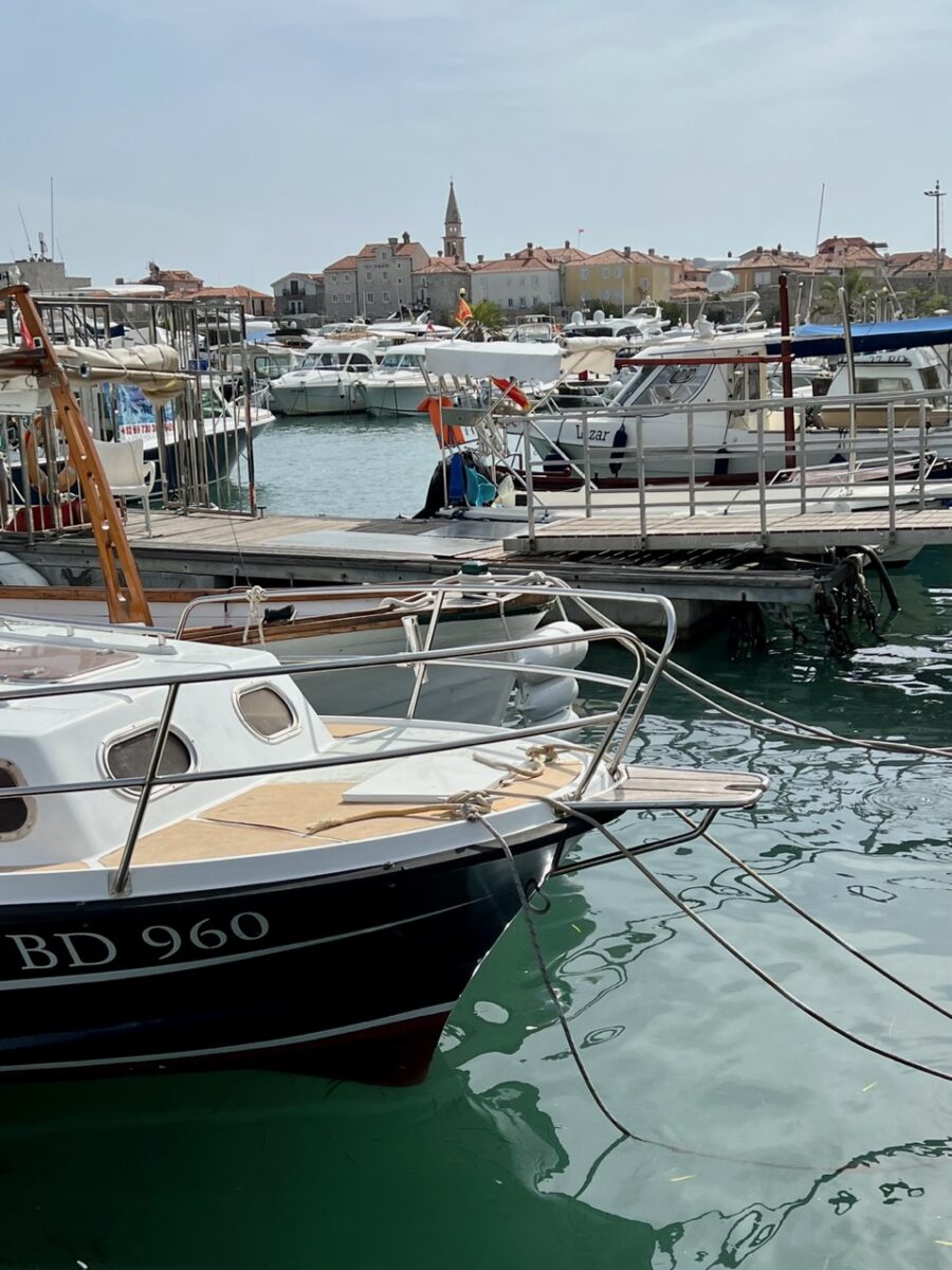 Budva Old Town with the boats of Budva's harbour in the foreground