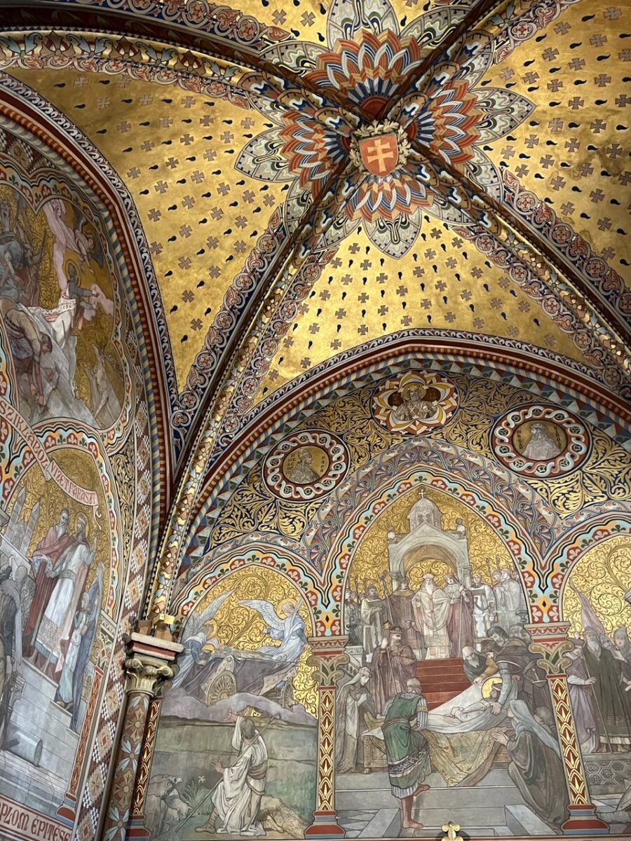 A close up of painted decoration inside Matthias Church in Budapest Hungary