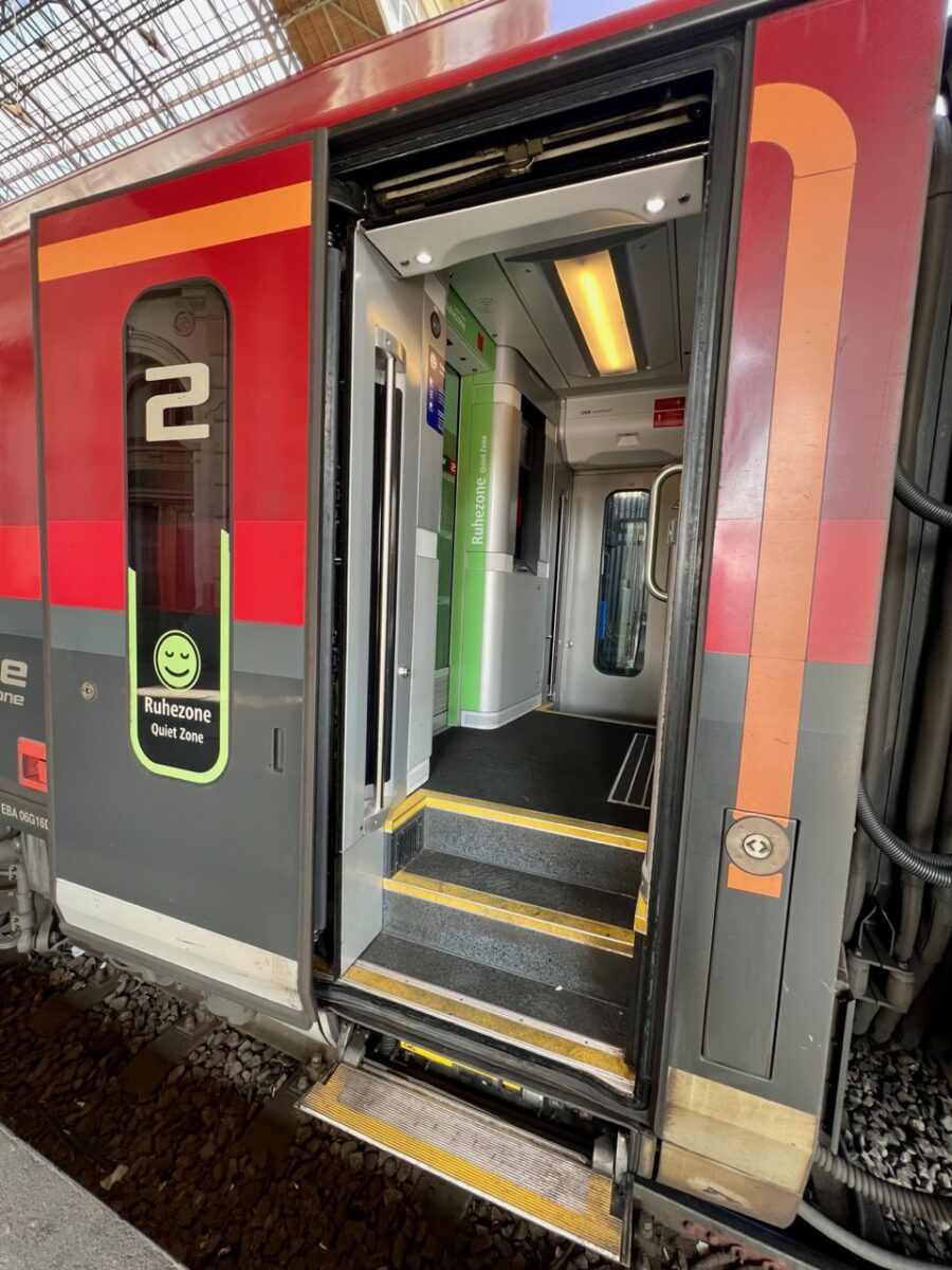 Entering one of the train cars on the Railjet train prior to traveling between Vienna and Budapest