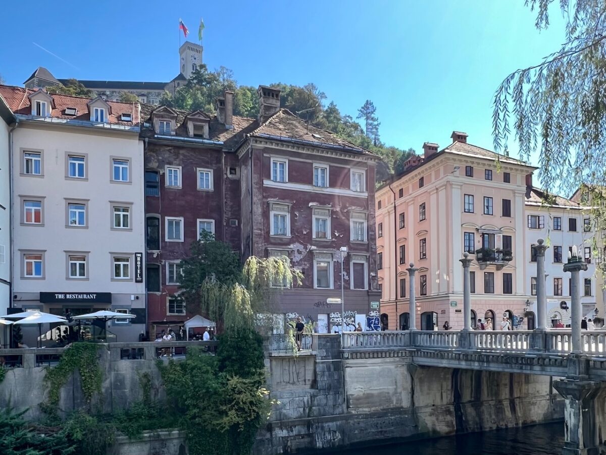Buildings in Old Town Ljubljana Slovenia with Ljubljana Castle in the background