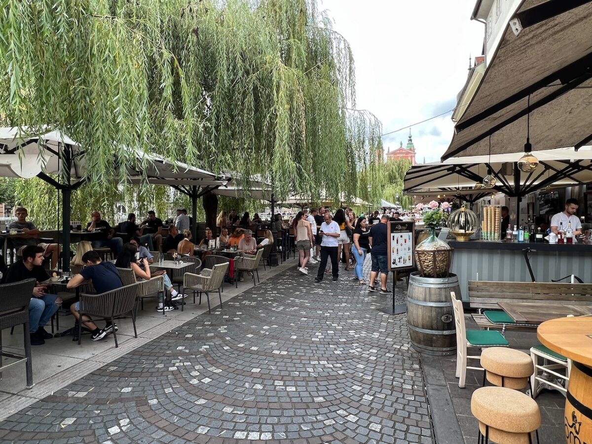 Restaurants lining the Ljulbjanica River in Ljubljana Slovenia