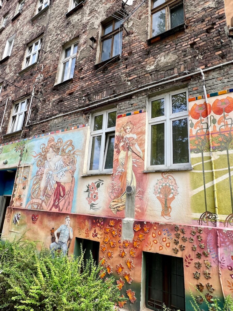 Colorful street art on the lower section of a building in the Nadodrze neighborhood in Wroclaw Poland