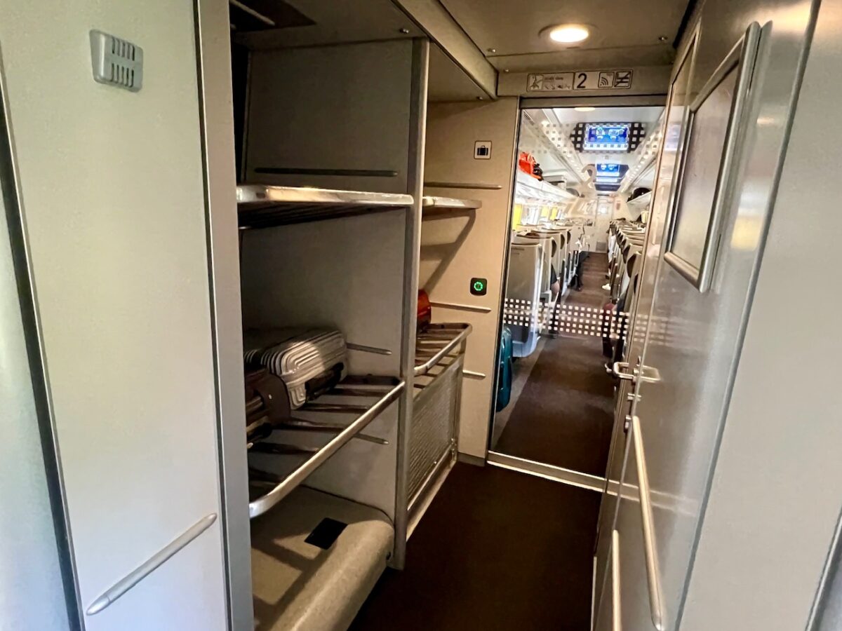 Luggage storage racks near the entry to a Polish EIP Pendolino high speed train