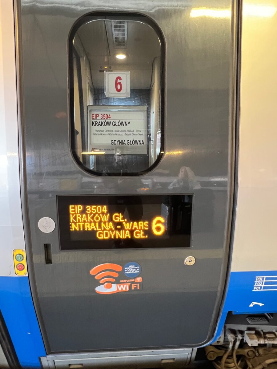 Signage on the EIP train from Krakow to Warsaw indicating train number and final destination 