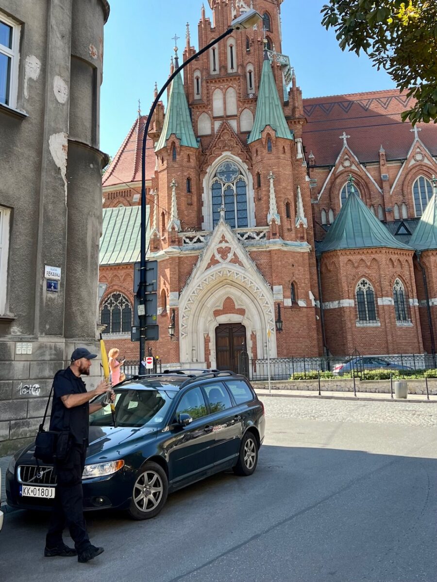 A tour guide explains the history of the Jewish Ghettos on a Jewish Krakow walking tour