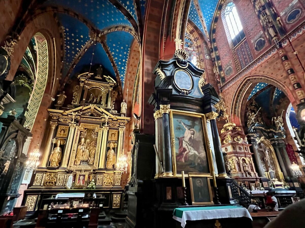 The red and blue interior of St Mary's Basilica in Krakow Poland