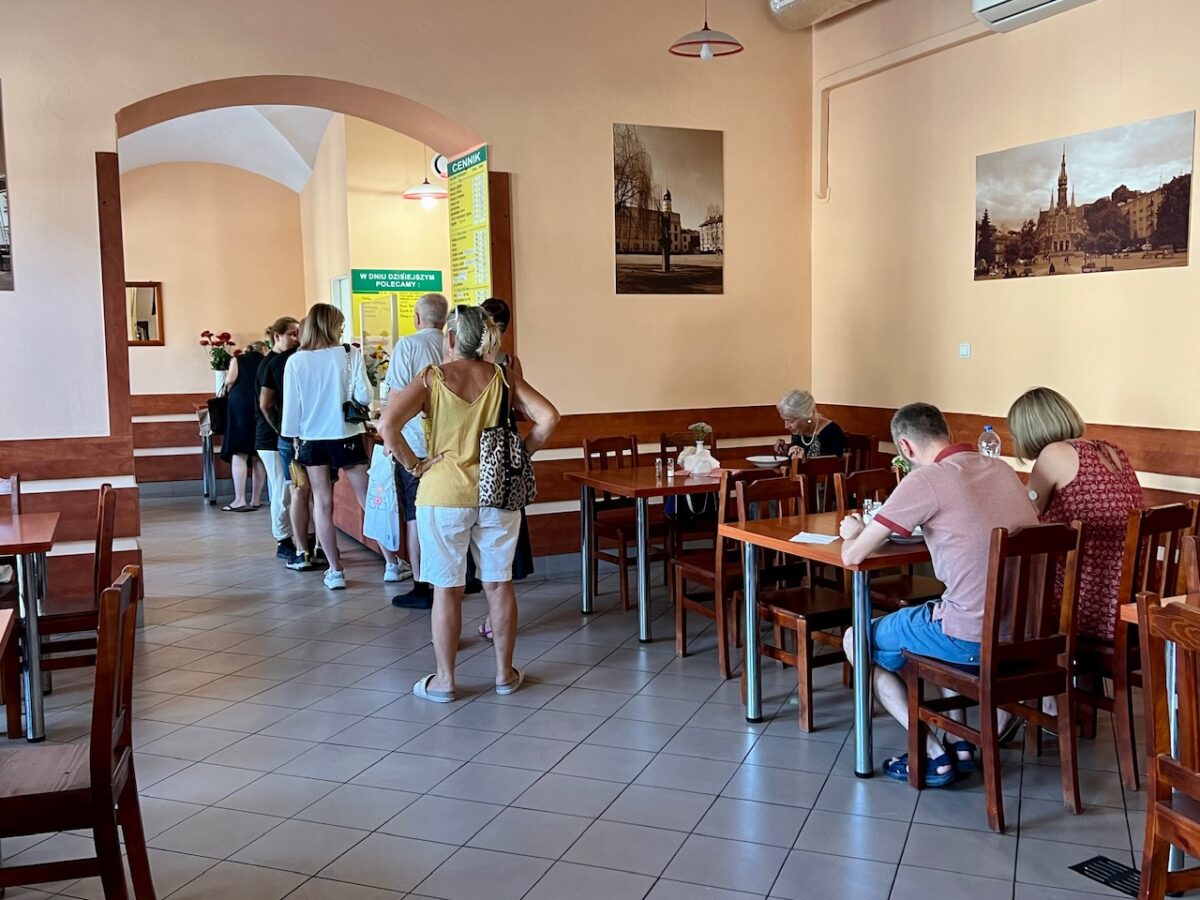People line up at Bar Krakus - a milk bar in Krakow Poland