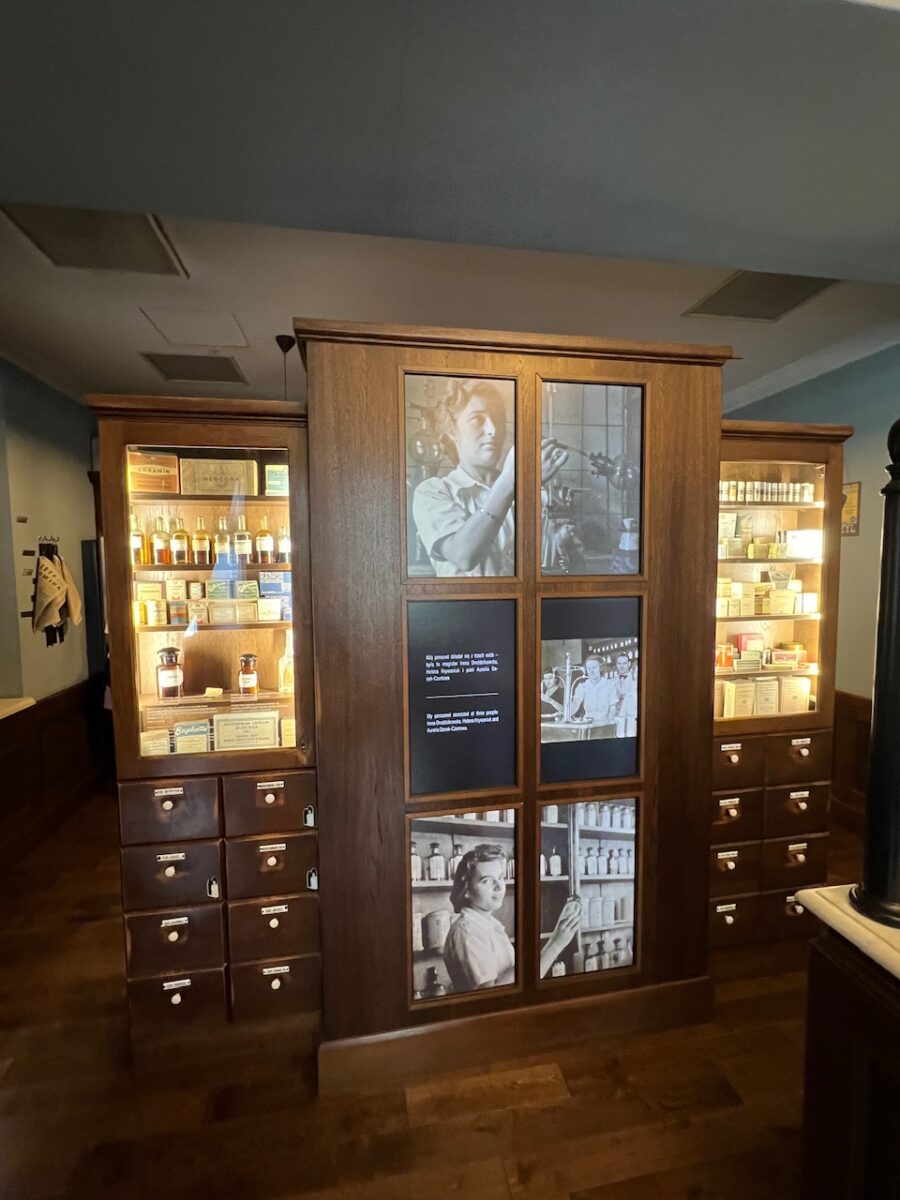 Cabinets inside the Eagle Pharmacy Museum in Krakow tell a multi-media story