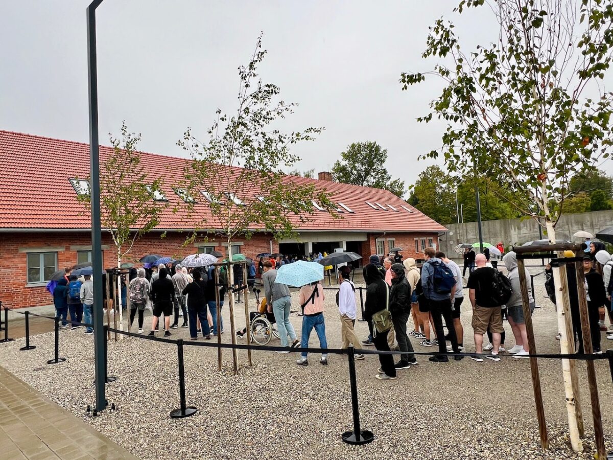The entry line outside the Auschwitz-Birkenau Museum on a rainy day