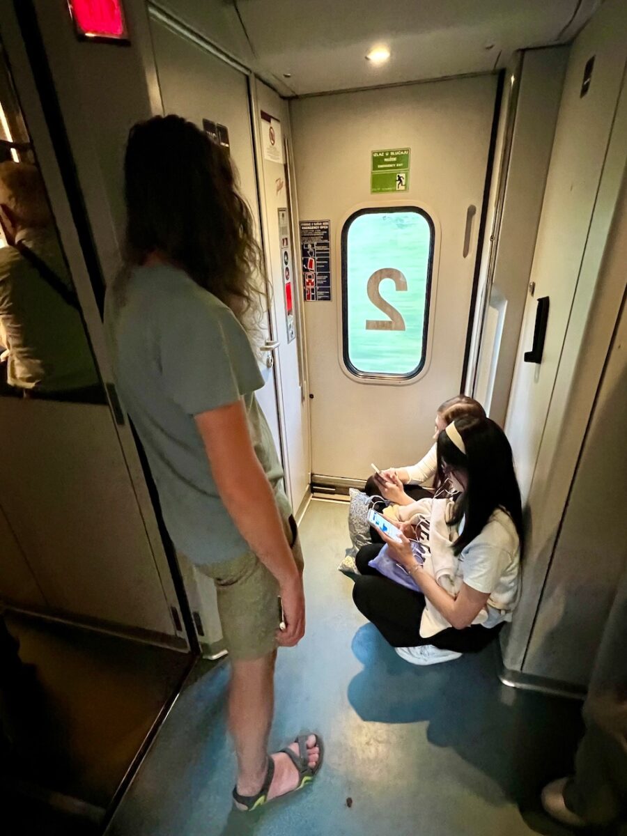 Passengers stand on the train from Mostar to Sarajevo