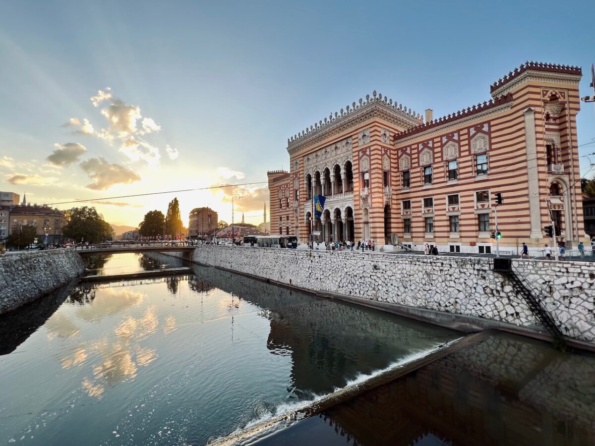 Sarajevo Town Hall and the Miljacka River at sunset
