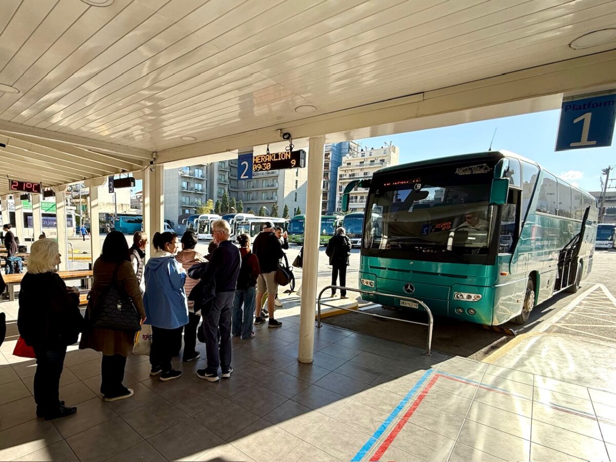 Riders line up to board the bus from Chania to Heraklion at the Chania Bus Station in Crete