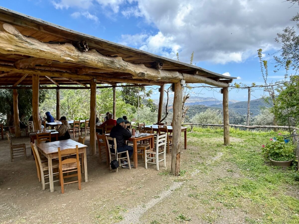 Diners inside the dining gazebo at Ntounias with a view across the Crete countryside