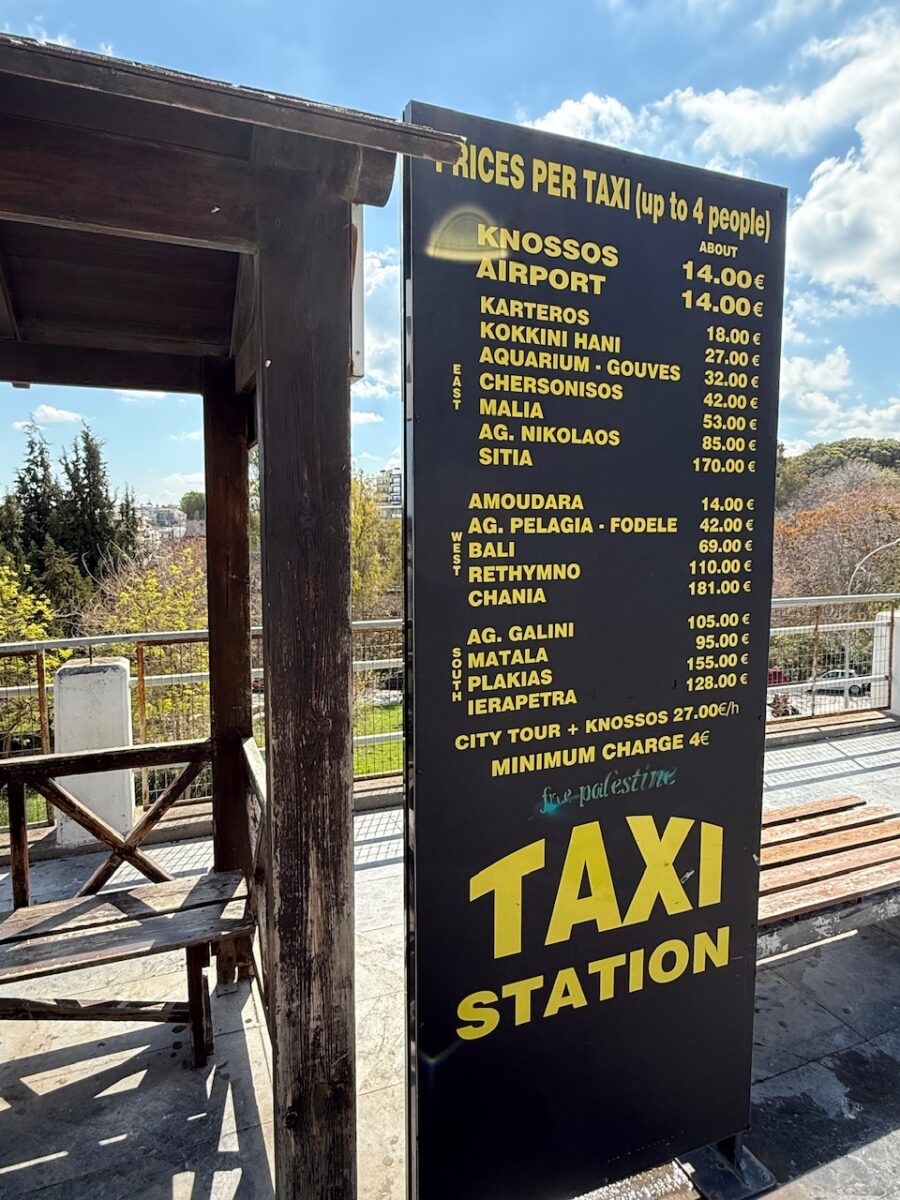 A taxi pricing board in Heraklion Crete indicating fixed prices including a cost of 181 Euros between Chania and Heraklion