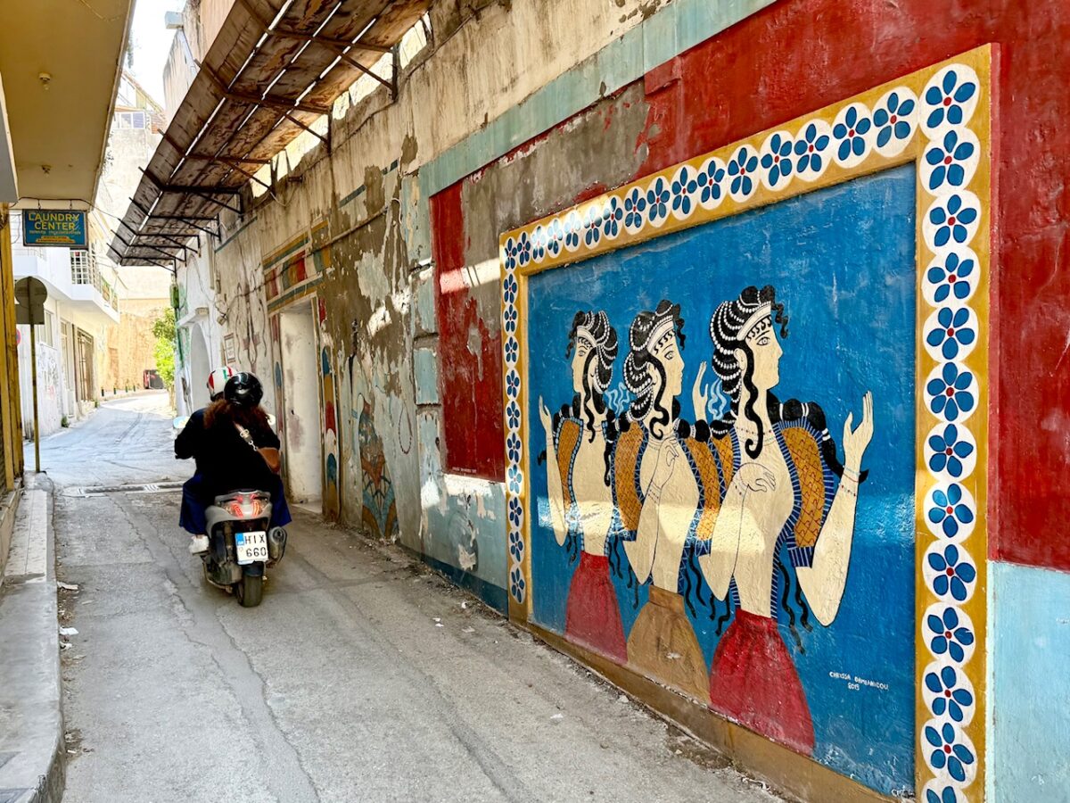 A narrow one way street with street art in central Heraklion Crete