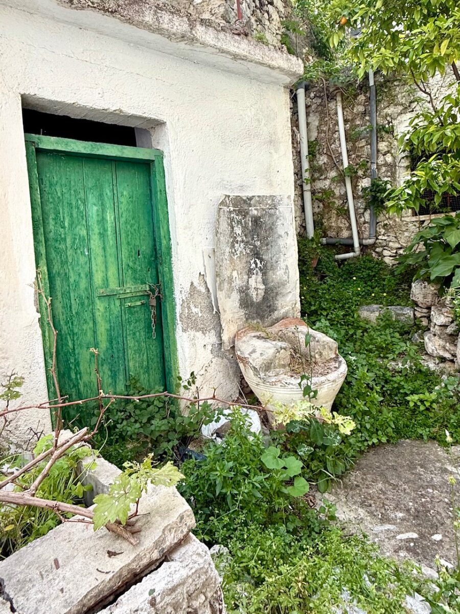 A green door in an old house in the village of Kritsa Crete