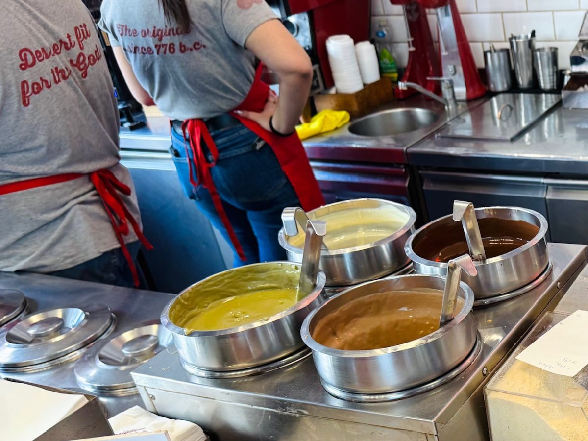 Different types of chocolate and pistachio toppings at LUKUMAΔΕΣ - a loukoumades franchise in Athens 