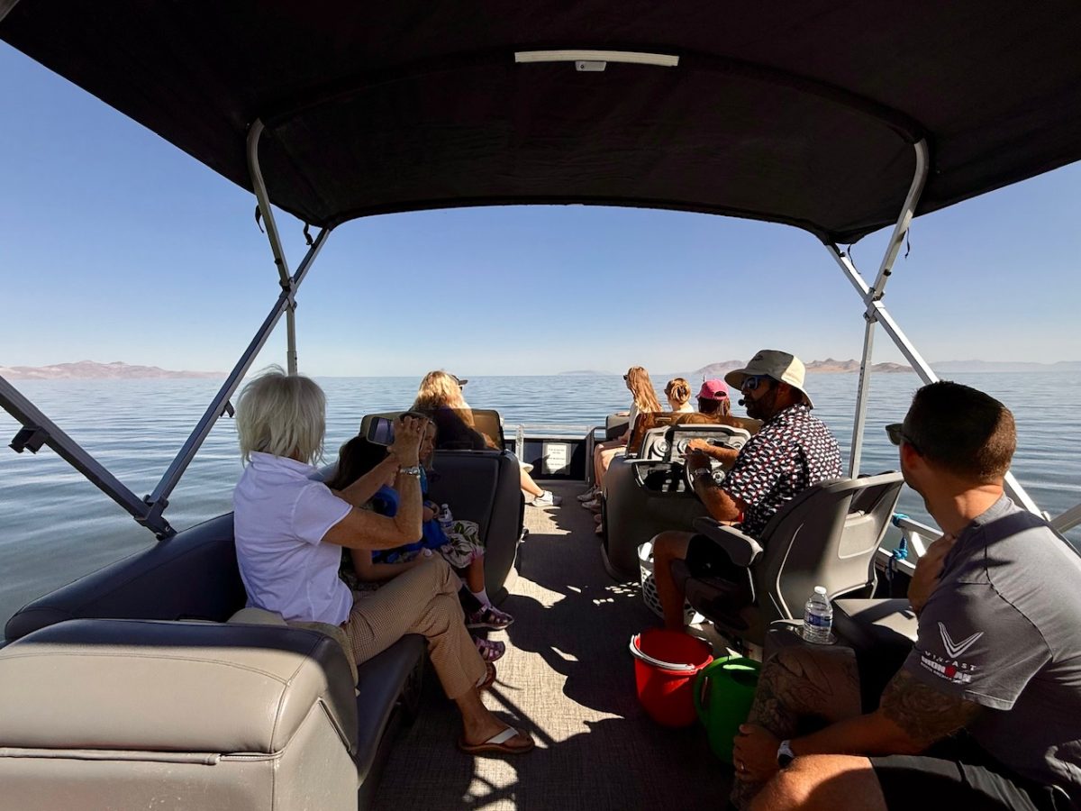 Tourists on a pontoon boat with Exclusive Excursions visit the Great Salt Lake