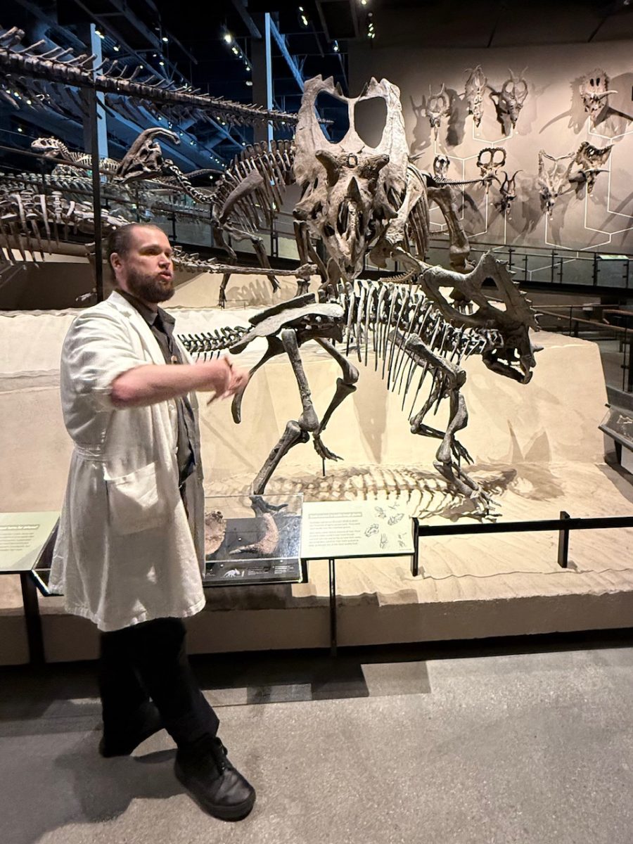 A paleontologist guides a small group on a dinosaur tour at the Utah Museum of Natural History - one of the most amazing things to do in Salt Lake City
