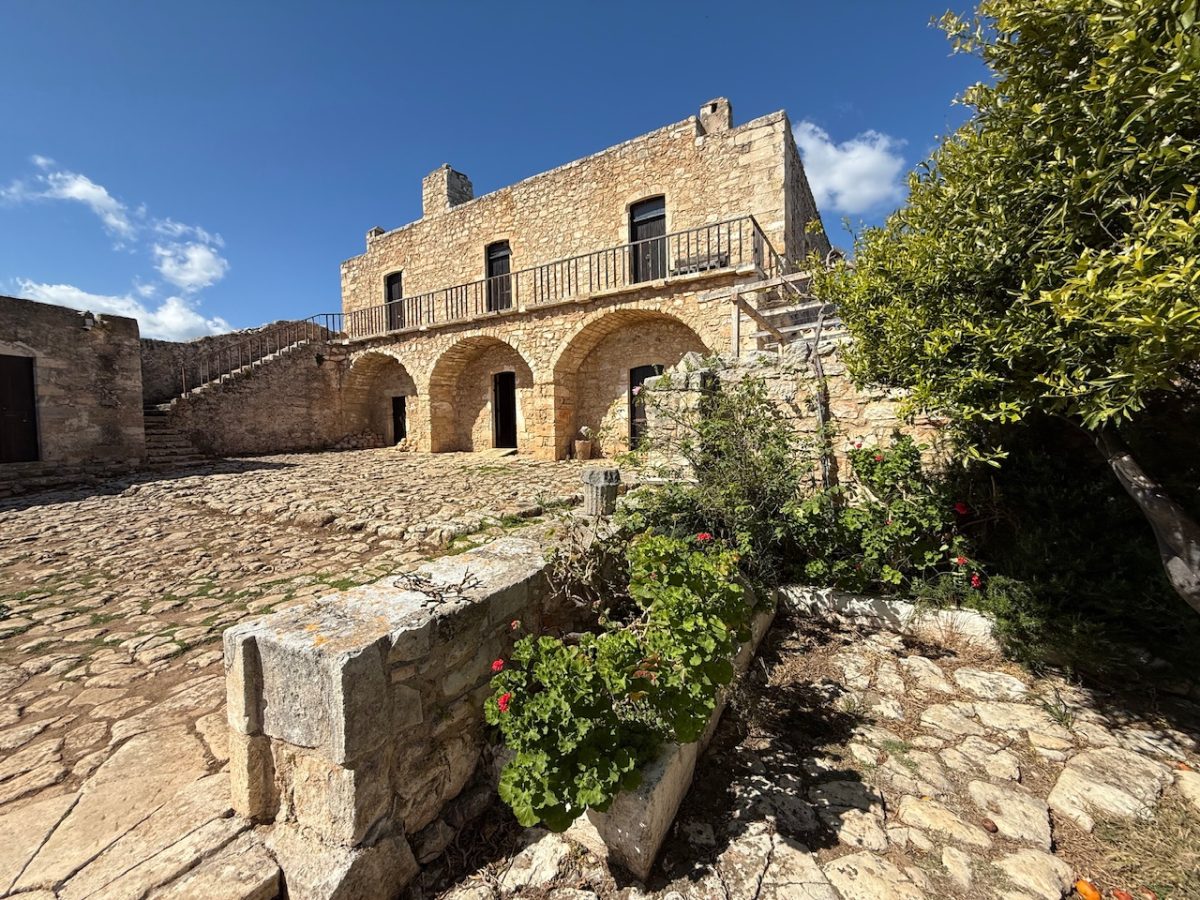 Inside the courtyard of The Monastery of St John the Theologian - a Venetian monastery inside the grounds of Ancient Aptera