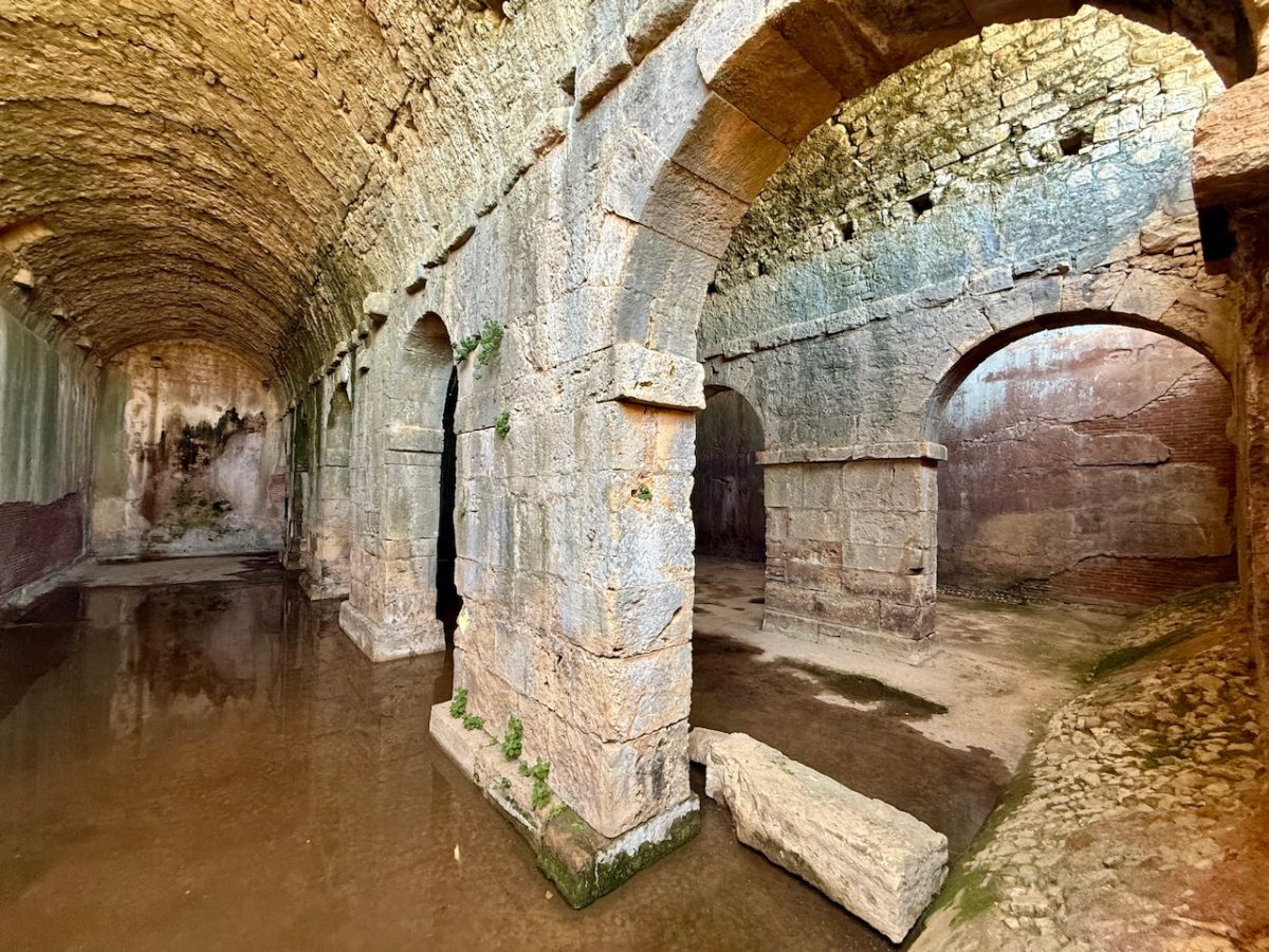 Looking inside the vaulted Roman cistern in Ancient Aptera in Crete